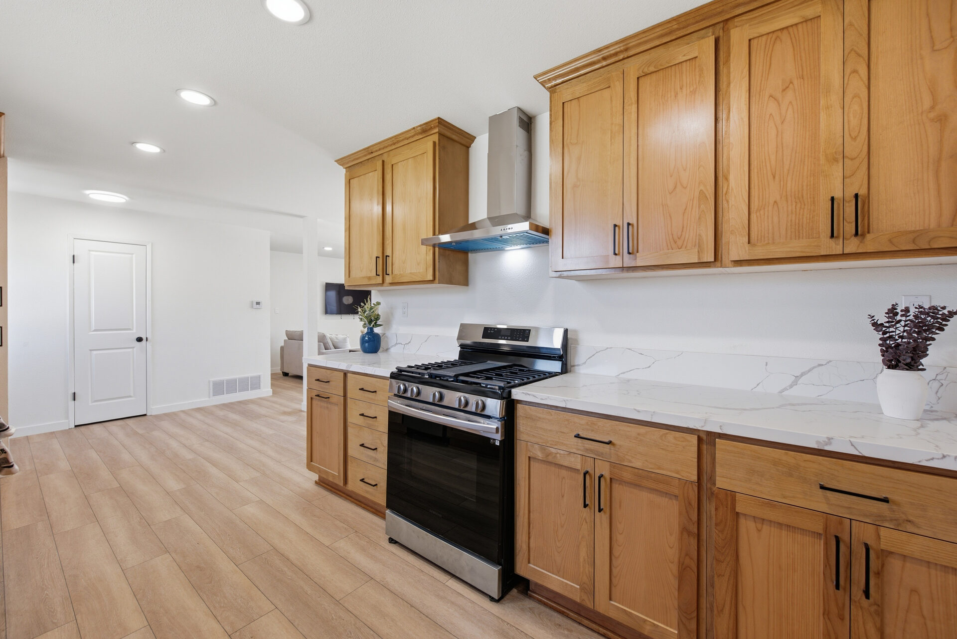 Remodeled kitchen with quartz counters and custom cabinets